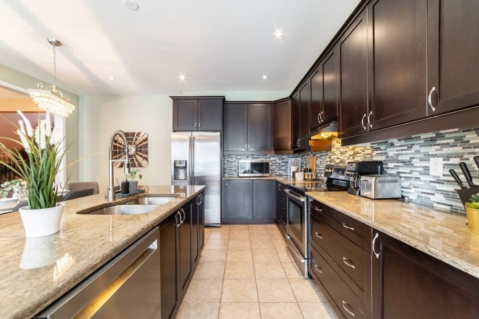 Featuring sleek stainless steel appliances, ample storage with easy-to-reach cabinets, and a spacious layout perfect for preparing meals together.  It offers all the space and tools you need to make mealtime a fun and effortless part of your day!
