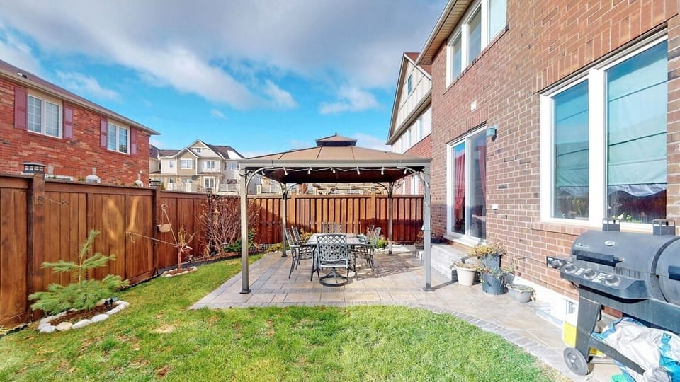 Enjoy our regularly maintained, fenced, spacious yard for fresh air, as well as an open area should you wish to bring your fur babies with you! Our backyard also features a patio with a table that seats up to six people, perfect for outdoor grilling.