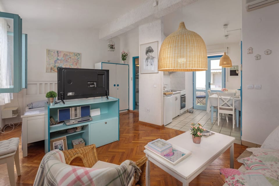 Family House, 1 Bedroom, Balcony (Charming Apartment Marina) | Living area | Flat-screen TV, stereo