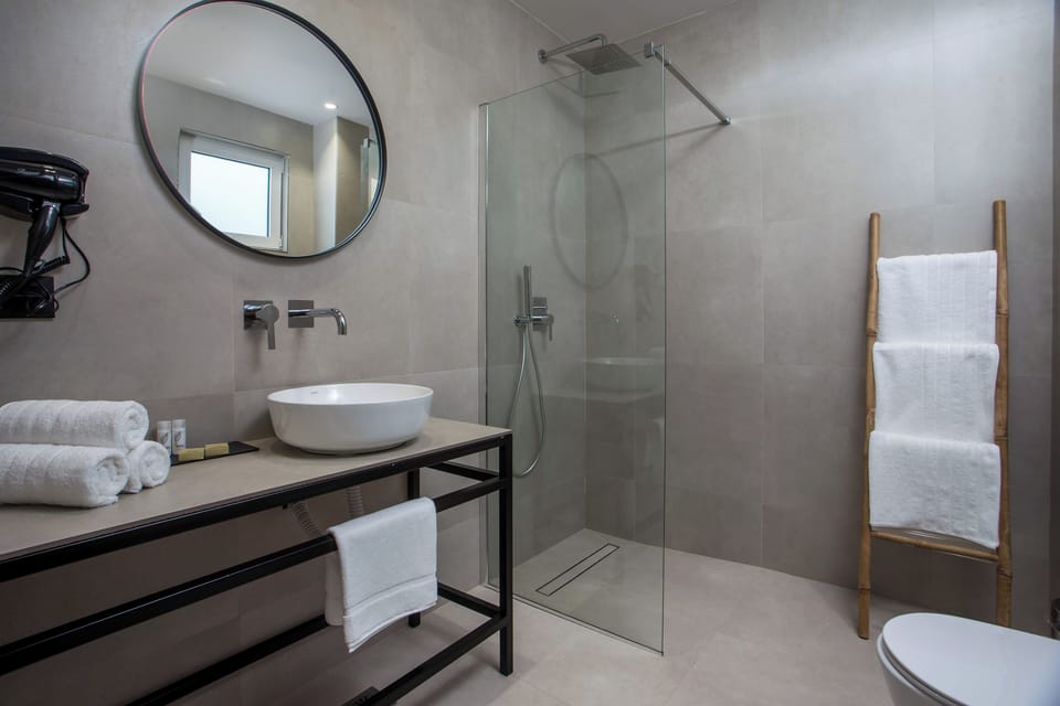 Deluxe Triple Room, City View | Bathroom | Shower, hair dryer, towels, soap