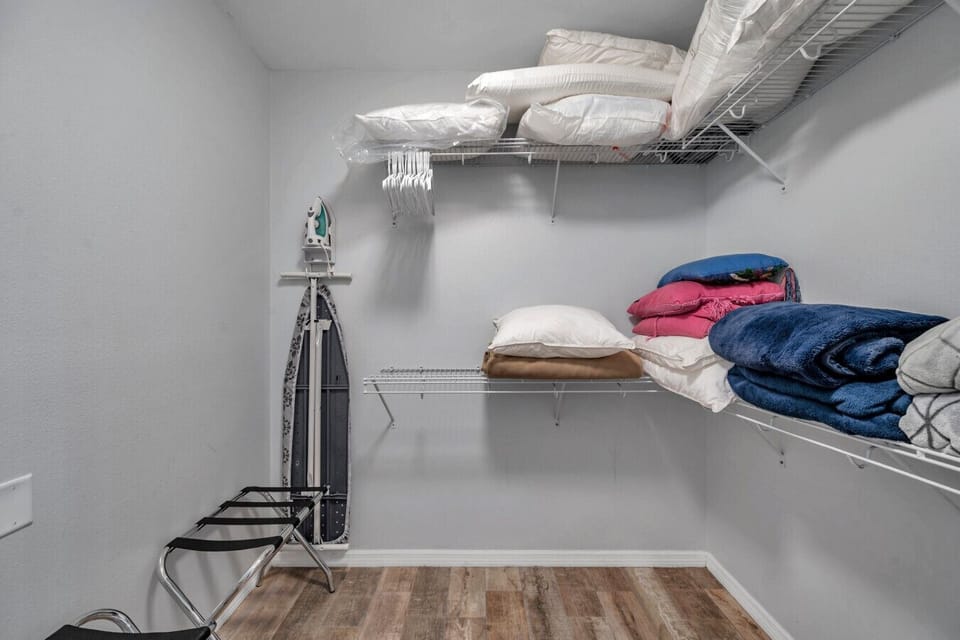 Organized closet space w/ shelving & hanging room to keep everything tidy.