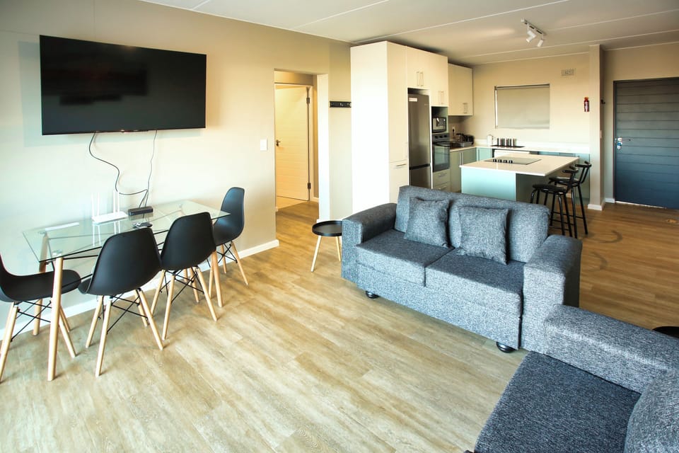 Family Apartment, Balcony, Bay View | Living area | 42-inch flat-screen TV with satellite channels, fireplace