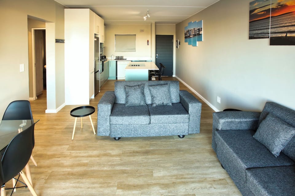 Family Apartment, Balcony, Bay View | Living area | 42-inch flat-screen TV with satellite channels, fireplace