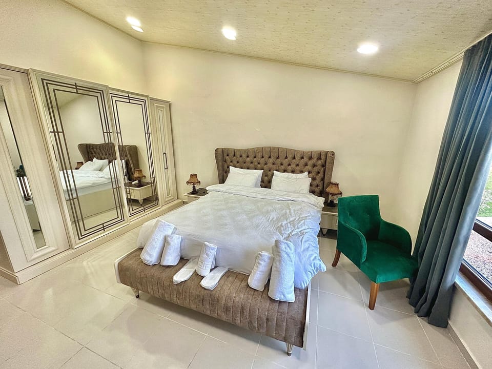 Family Triple Room, Garden View | Desk, laptop workspace, blackout drapes, iron/ironing board