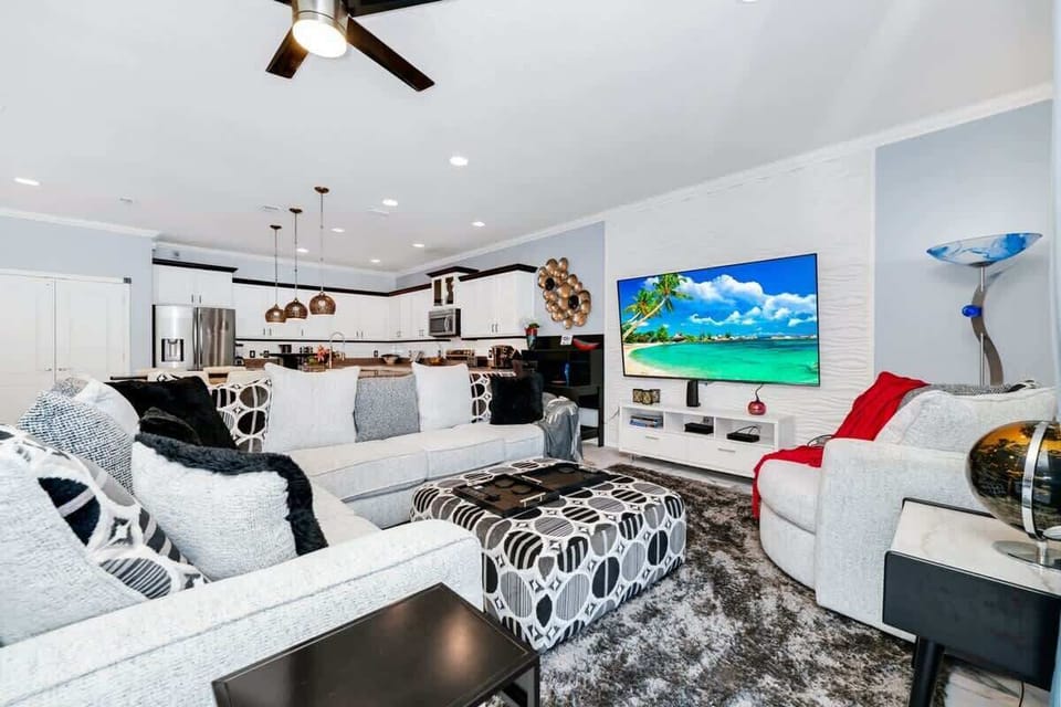 Spacious living area with cozy seating and a welcoming vibe.