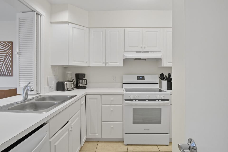 Kitchen - Repainted in 2025, opens up to living room & dining room