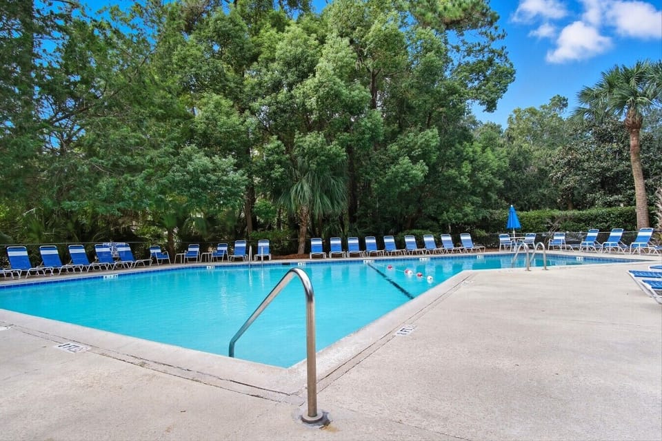 Spacious pool deck with plenty of loungers for the family to enjoy
