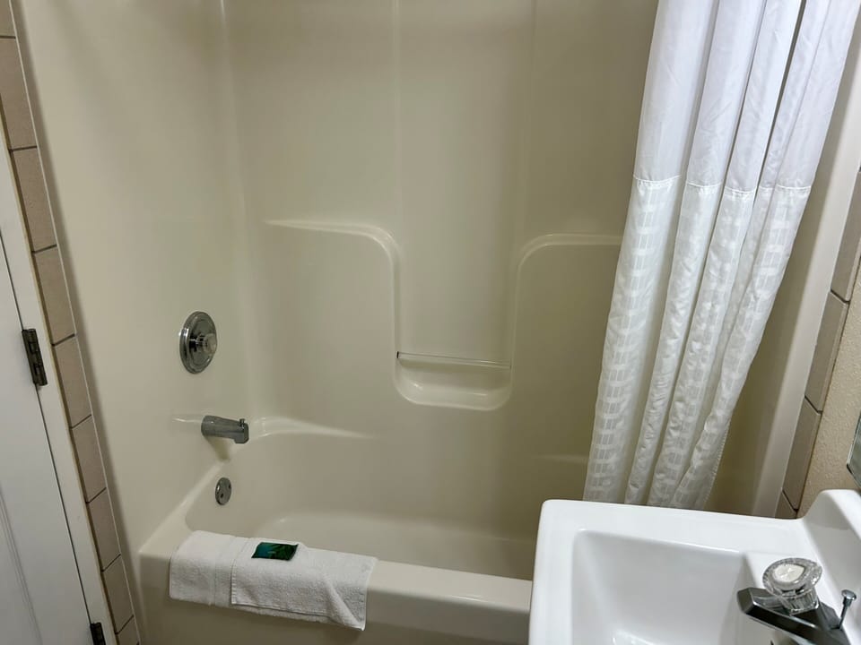 Deluxe Room, 2 Queen Beds | Bathroom | Combined shower/tub, designer toiletries, hair dryer, towels