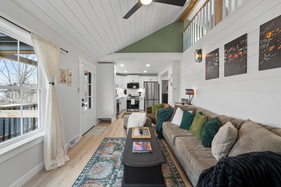 Living room with view into kitchen