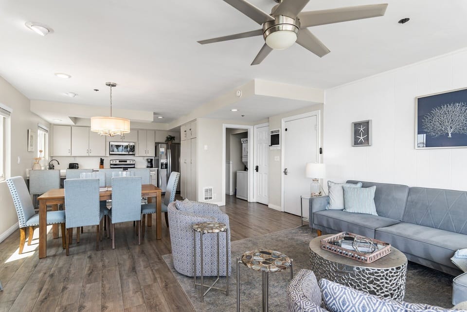 Open-concept kitchen and dining area designed for gathering and entertaining, featuring modern appliances, a spacious dining table, and plenty of natural light, perfect for cooking meals and enjoying time together.