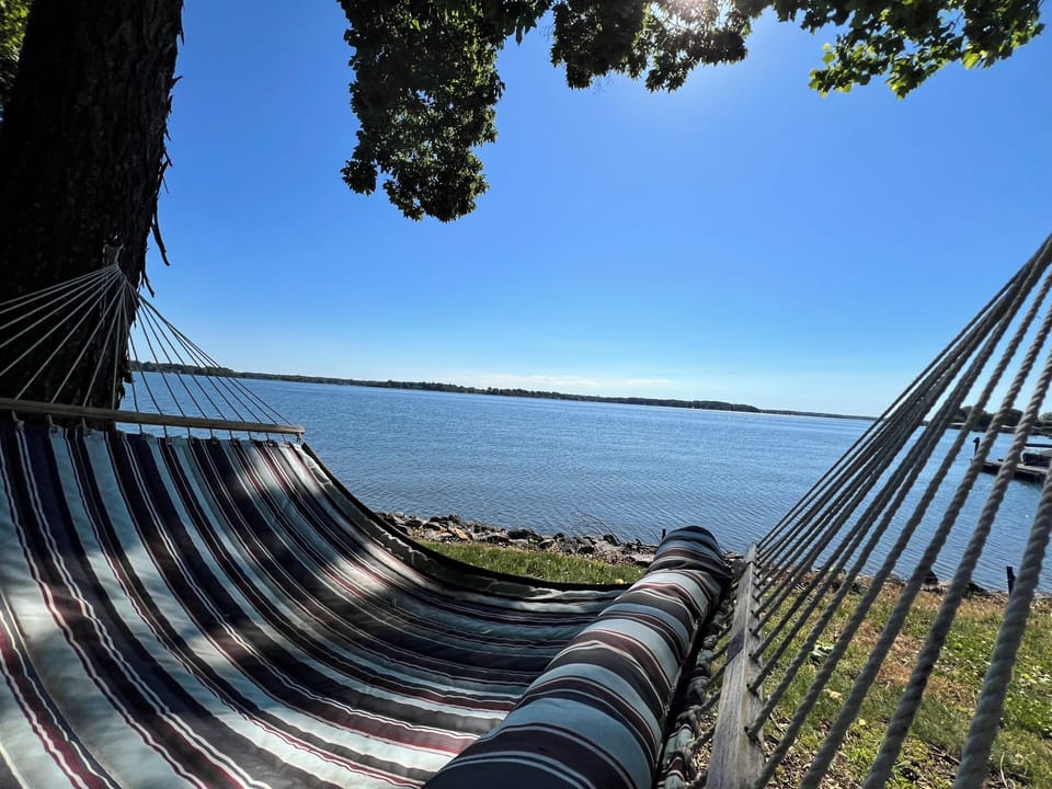 Relax and read a book in the hammock right next to the water.