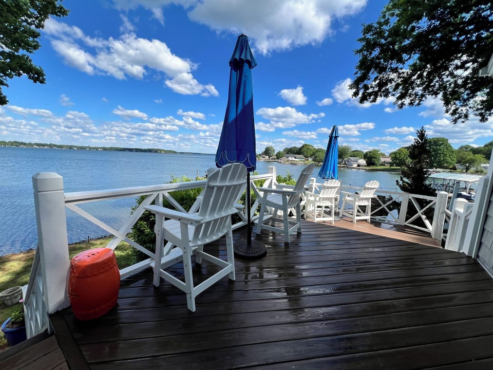 Enjoy coffee and wine on the deck overlooking the water.