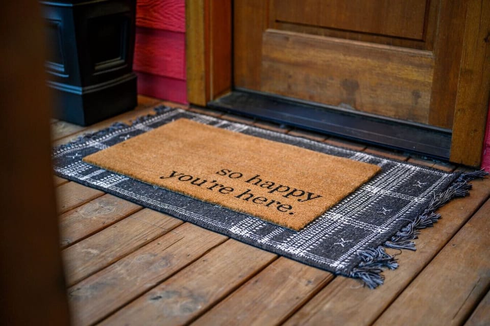 Welcome to Lil Red—the doormat pretty much says it all, because the second you step inside, you`re genuinely going to be happy you`re here.