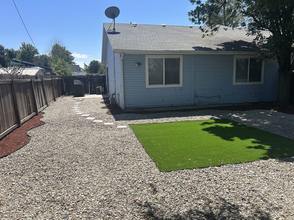 grill and fully fenced backyard