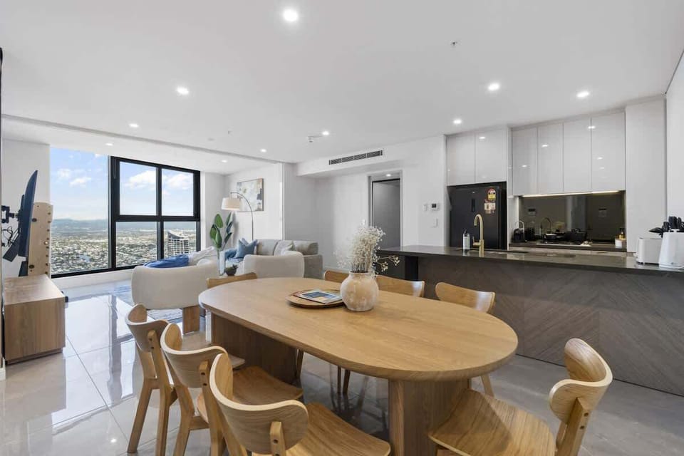 Dining Area features natural wood dinning table with 8 chairs