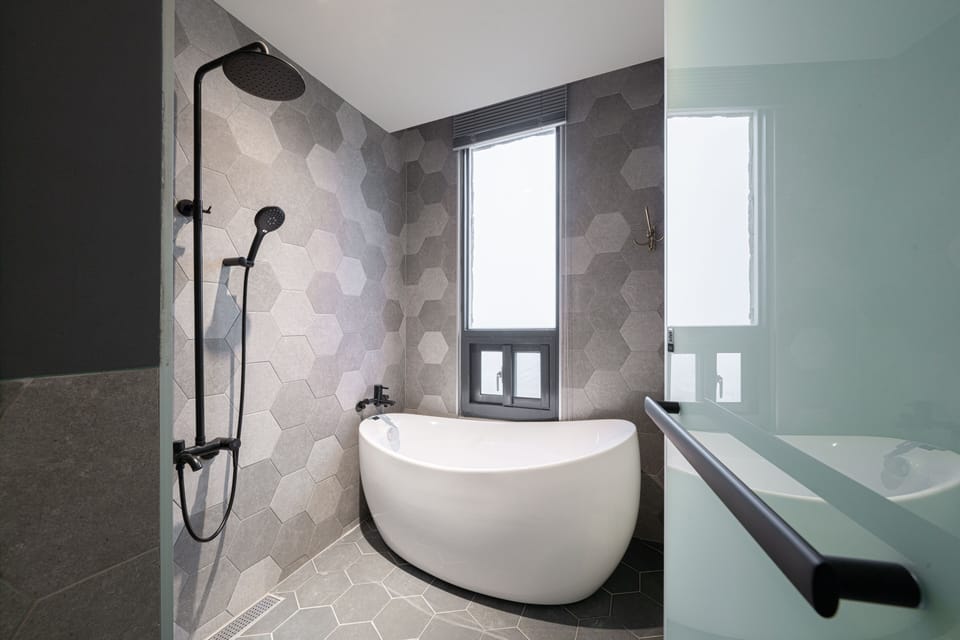 Comfort Quadruple Room, 2 Double Beds | Bathroom | Hair dryer, slippers, towels, soap