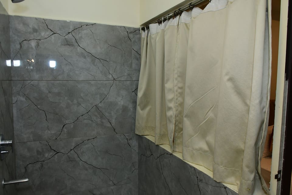 Suite Room | Bathroom | Shower, free toiletries, towels, soap