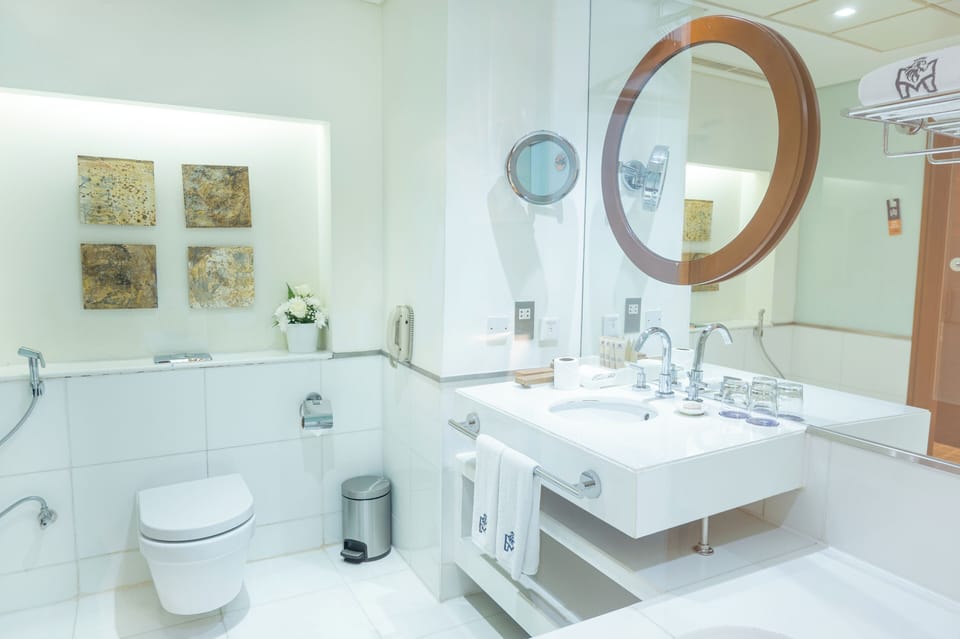 Premier Room | Bathroom | Combined shower/tub, deep soaking tub, rainfall showerhead