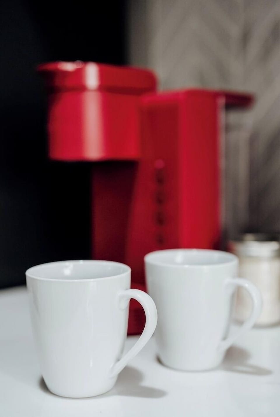 Enjoy your favorite hot beverages with ease—cups are provided alongside a convenient Keurig coffee maker