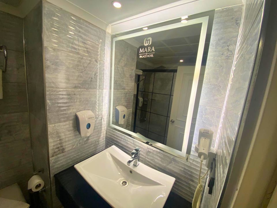Economy Single Room | Bathroom | Shower, hair dryer, slippers, soap