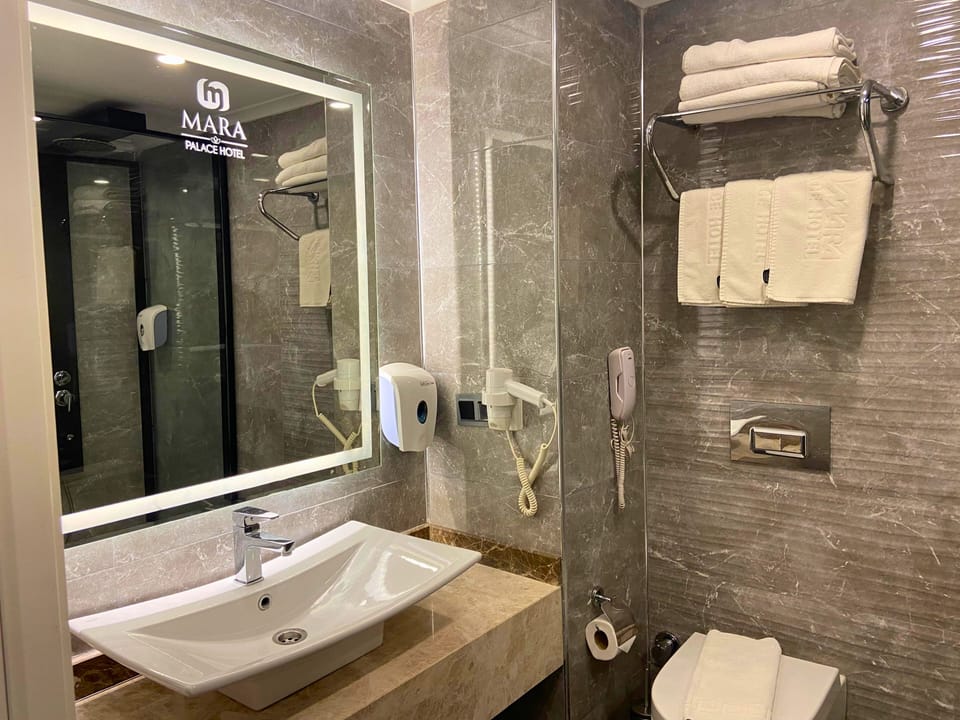 Triple Room | Bathroom | Shower, hair dryer, slippers, soap