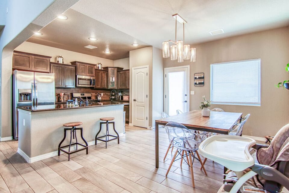 Dining Area with Open Kitchen and Living Room Views