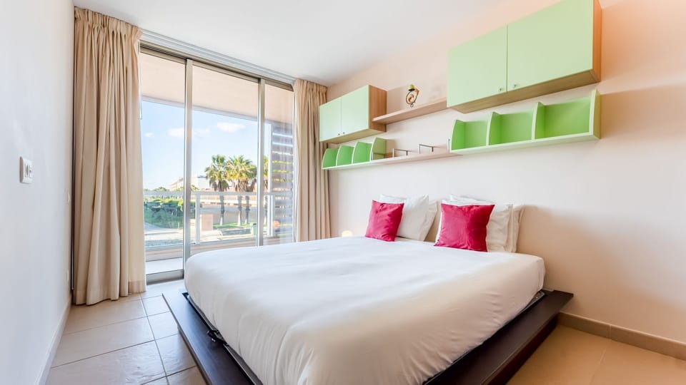 Wake up refreshed in this stylish bedroom with a beautiful view of the outdoor space. A serene retreat to end your day. #PerfectGetaway #ComfortAndStyle #LuxuryApartment