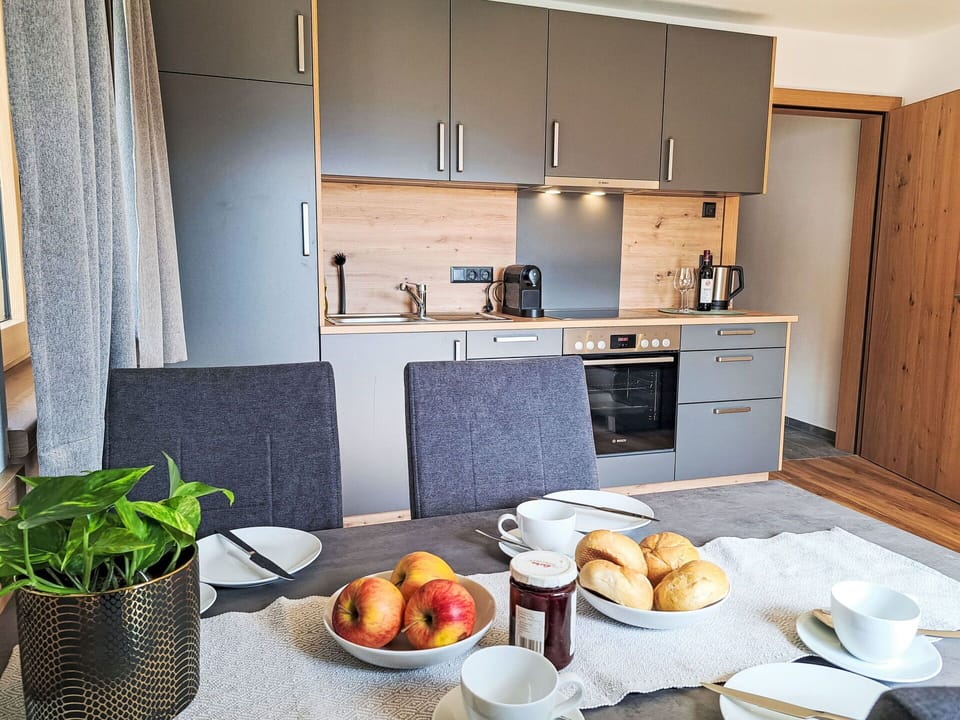 Furniture, Wood, Flooring, Interior Design, Kitchen, Floor, Cabinetry, Countertop, Kitchen Appliance, Apartment