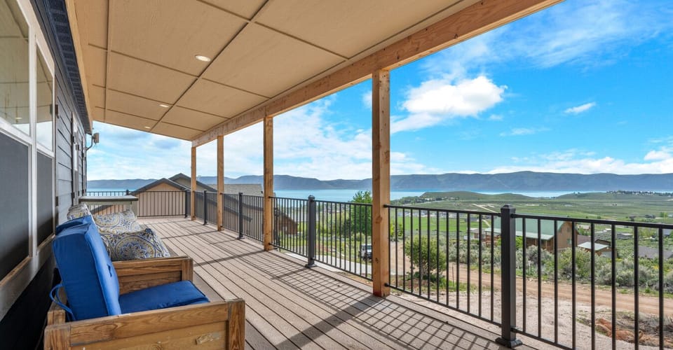 Expansive 66 ft porch with Bear Lake views, great for relaxing outdoors.