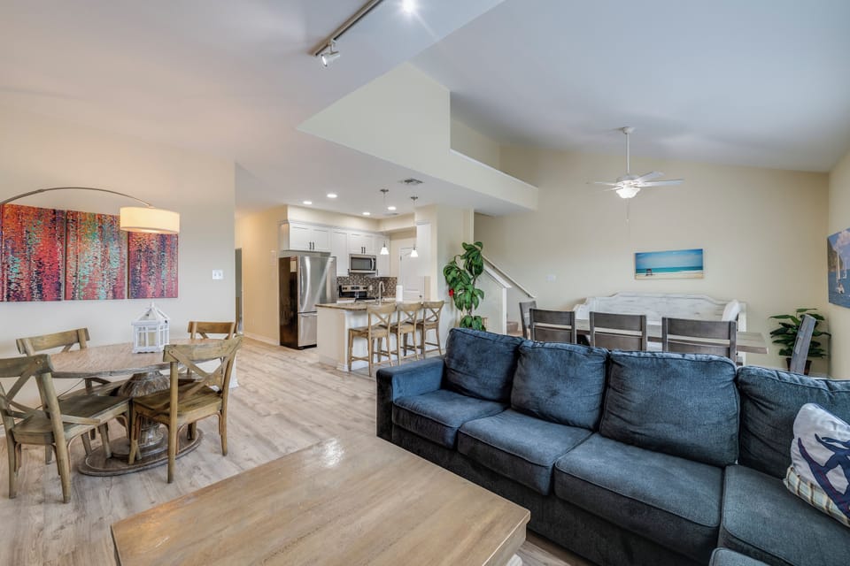You'll love this spacious open-plan living area, where natural light fills your living room, dining space, and modern kitchen—perfect for gathering with friends and family during your stay.