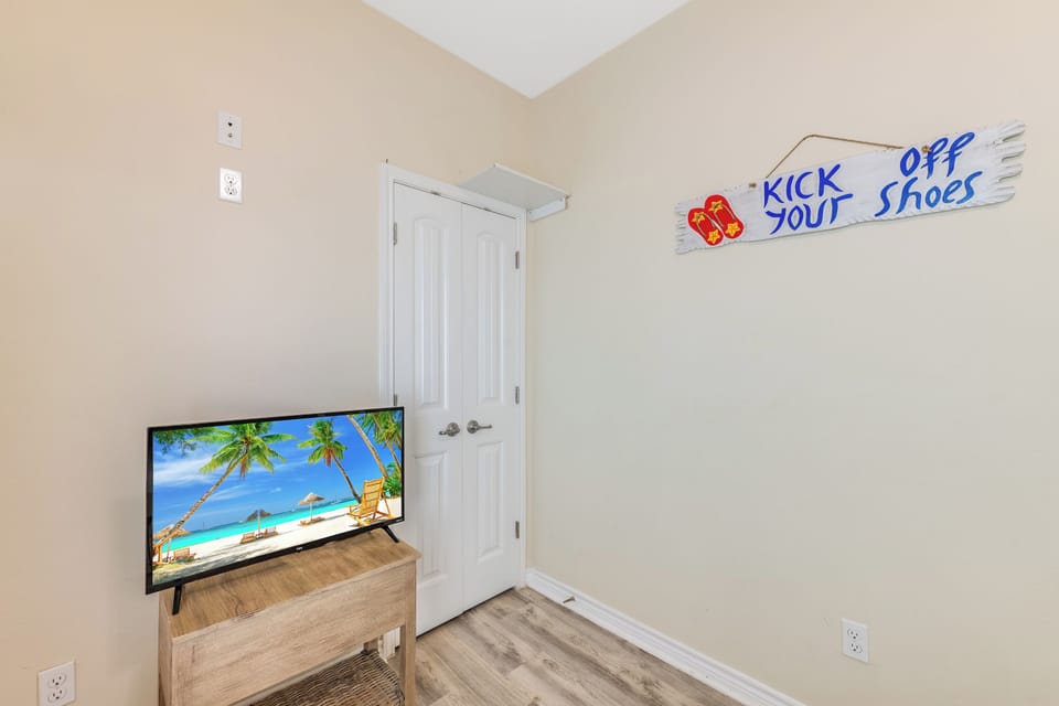 Kick off your shoes and settle in! Your cozy space features a large TV for movie nights and tropical beach vibes to help you unwind.