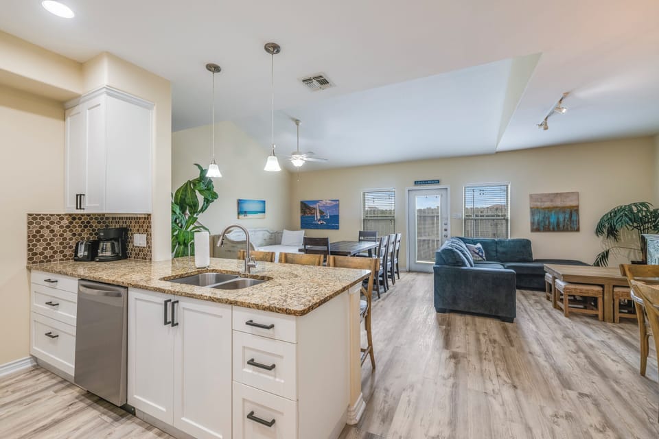 Step into your open-concept haven where the kitchen flows seamlessly into the living and dining areas—perfect for gathering, cooking, and unwinding after a day of adventure.