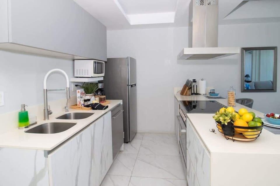 The kitchen is fully equipped with modern appliances