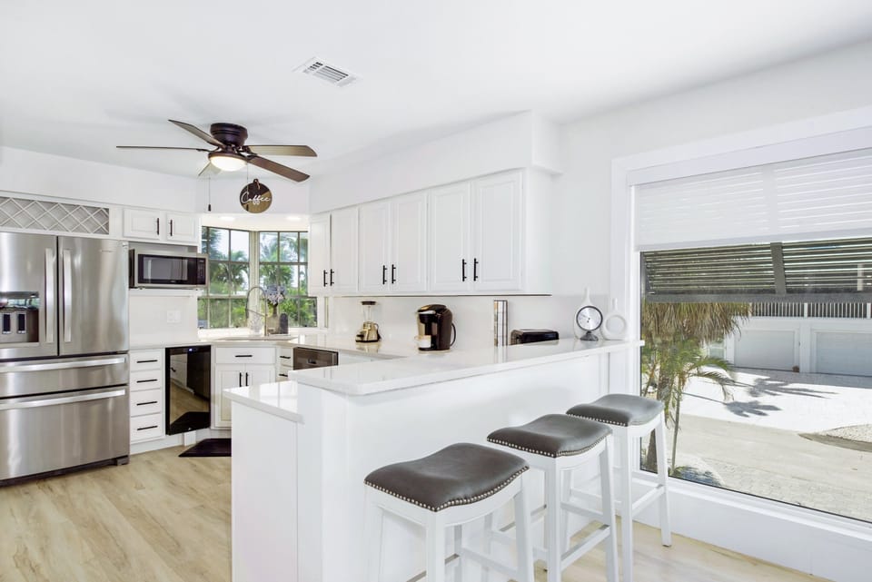 Upstairs kitchen open concept with breakfast bar