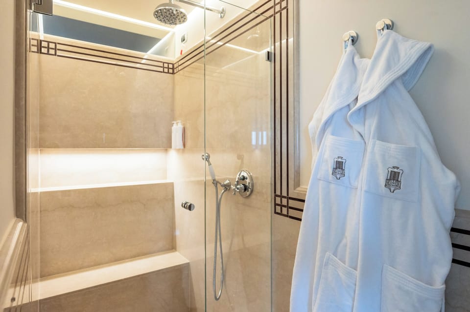 Family Suite | Bathroom | Hair dryer, slippers, towels, soap