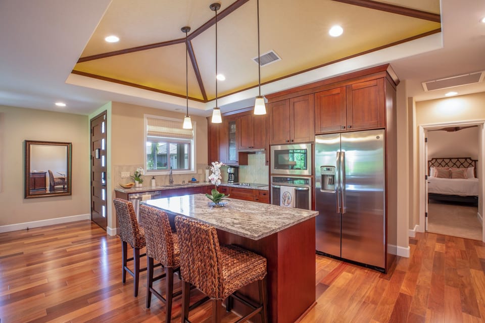 Cook like a pro in the chef-inspired kitchen with stainless steel appliances, granite countertops, and a spacious island.