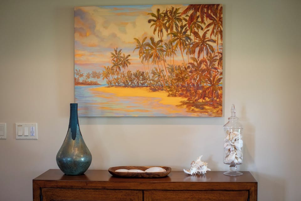 Local art and tropical touches set a warm island tone the moment you enter the home.