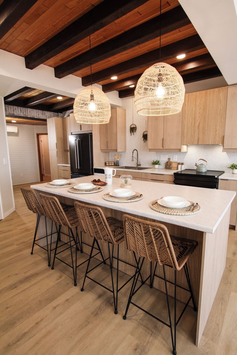 Enjoy our fully-stocked kitchen with original wood beam ceiling and bar seating.