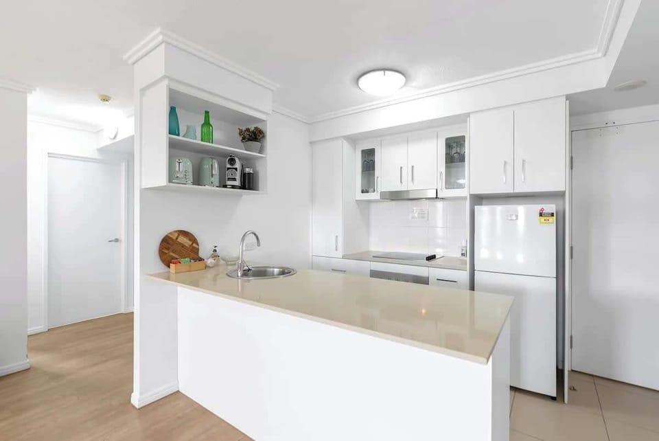 Prepare home-cooked meals in the fully equipped kitchen with an oven, dishwasher, espresso machine and ample kitchen bench.