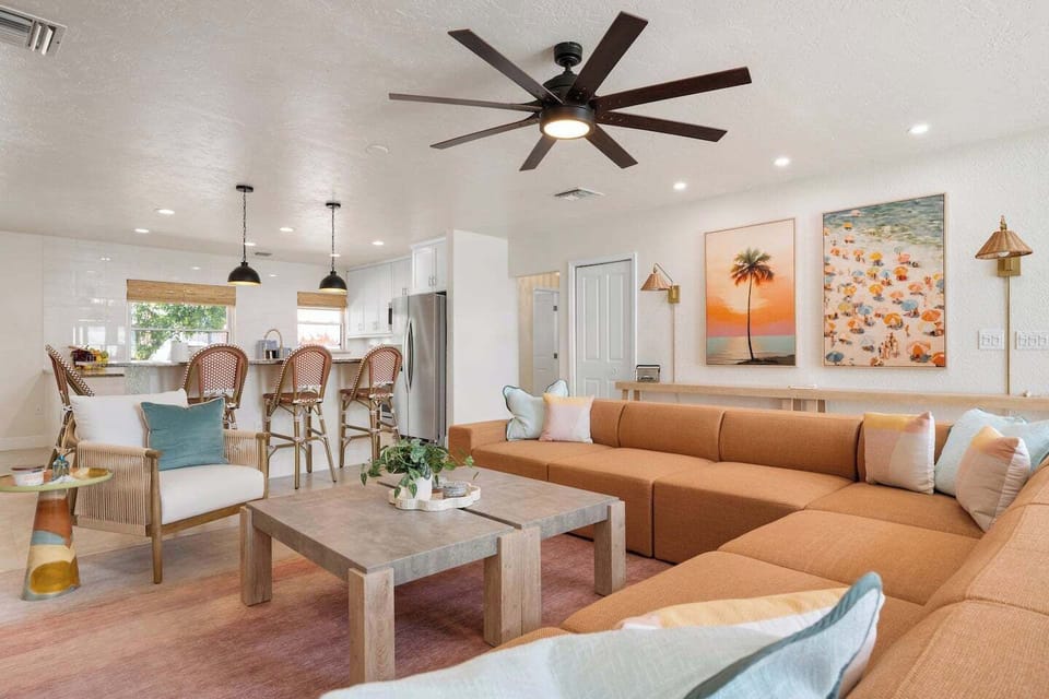 Gather the whole crew in the beautiful, bright, and open living room, featuring a brand-new, oversized sectional big enough for the whole family to pile onto after a day in the sun!