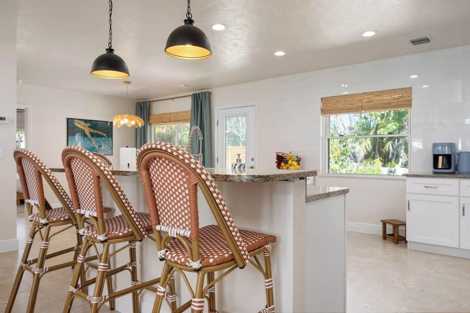Pull up a barstool and soak in the laid-back vibes — perfect for extra seating, morning coffee chats, or sharing beach day stories with family and friends!
