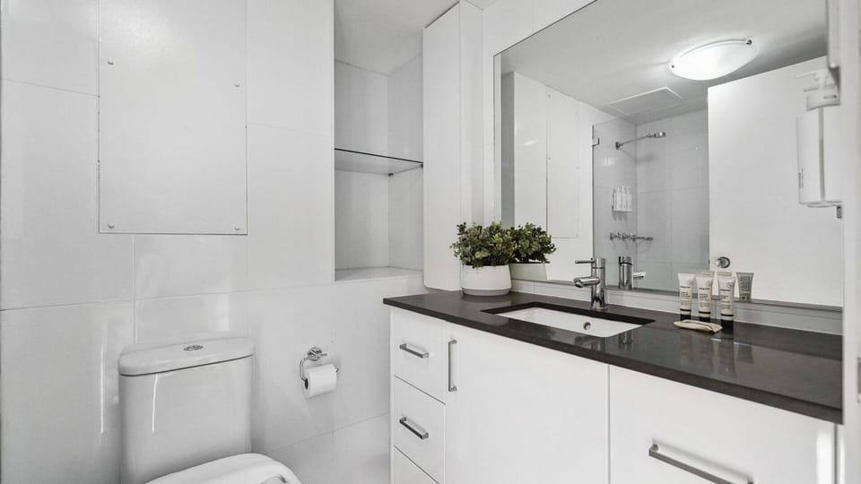 Enjoy a bright and spacious bathroom featuring a clean, contemporary design.