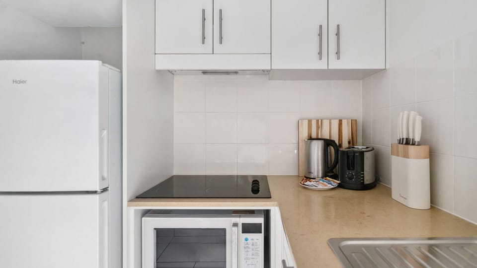 Clean and functional kitchen with contemporary appliances and plenty of space.