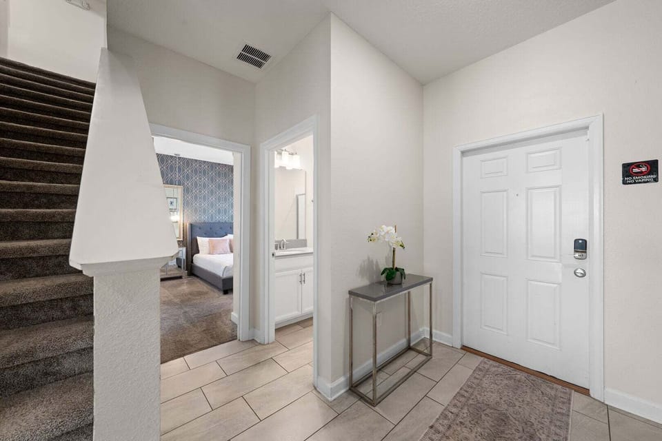 The first floor also includes a guest room and a conveniently located shared bathroom.