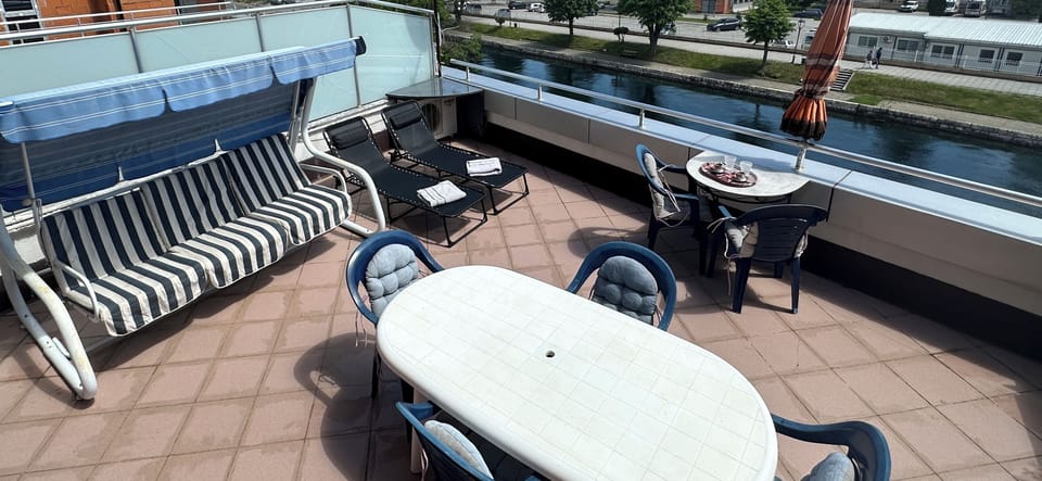 Terrace sun chairs, swing and outdoor table