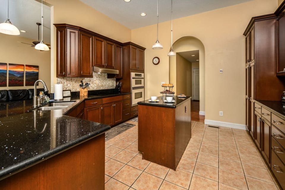 Kitchen | Spacious and fully equipped with modern appliances, granite countertops, and a center island for easy meal prep
