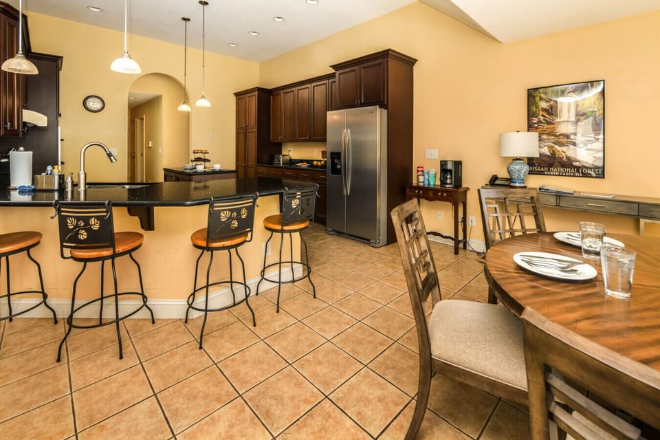 Open Kitchen | Granite Counters | Breakfast Bar Seating | Tile Floors