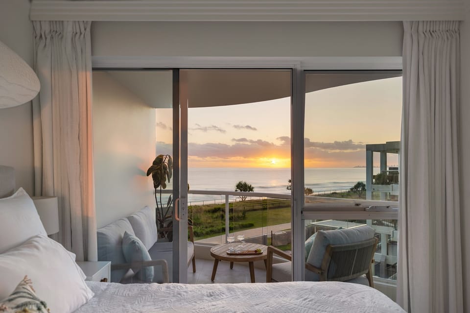 Private beachfront balcony directly off the king bedroom - relax and soak in golden sunrise views.