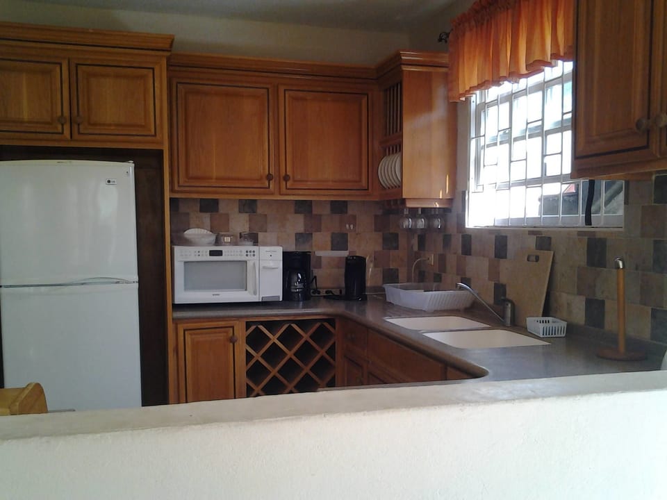 Family Apartment, 2 Bedrooms, Accessible, Pool View (Ginger Lily) | Private kitchen | Coffee/tea maker, full-size fridge, microwave, stovetop