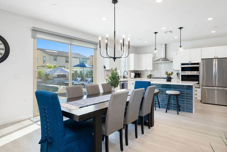 Host unforgettable dinners in this bright and open dining space with seating for 10, a fully equipped chef’s kitchen, and direct backyard access—ideal for families and group getaways.